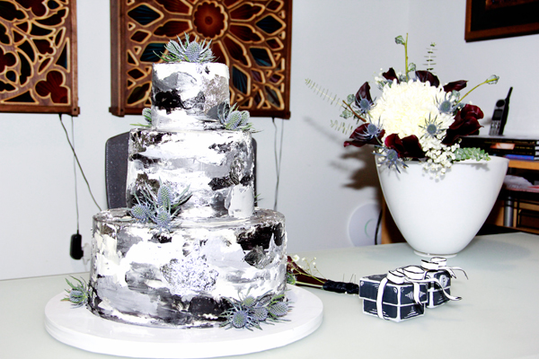 Fancy black and grey with silver leaf wedding cake.